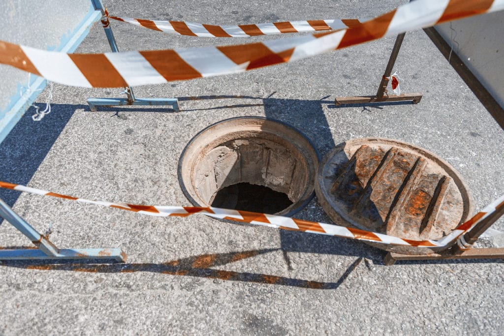 open manhole in street